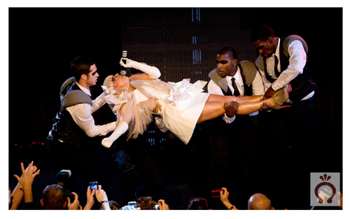 lady_gaga_live4 How many masked gays does it take to lift little Gaga?