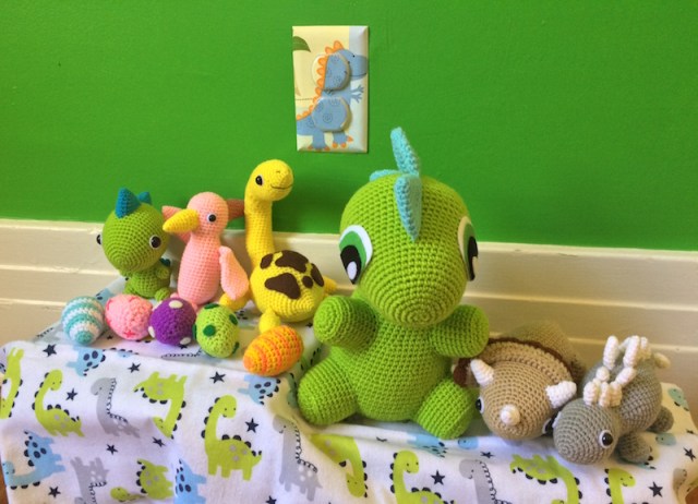 Crochet dinos by IvoryTreeHouse, outlet covers by cathyscraftycovers, receiving blanket from TJ Maxx.