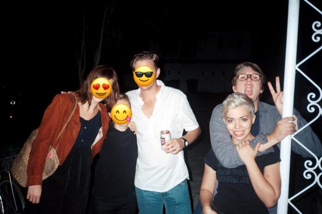 five friends outside on a porch at a party, including both raquel and meg making weird faces