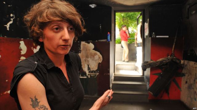 Armine Oganezova, the owner of DIY, an alternative music bar in Yerevan, stands inside what is left of her club after a fire-bomb attack in May 2012. From RadioFreeEurope.