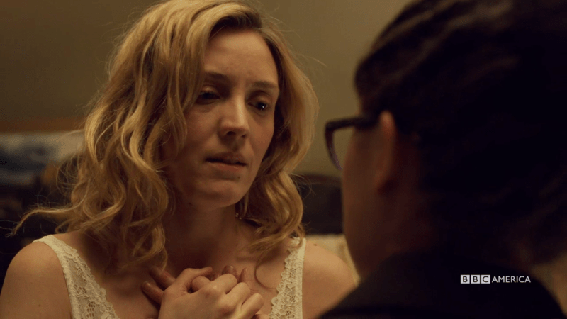 Delphine holds COsima's hand over her heart again