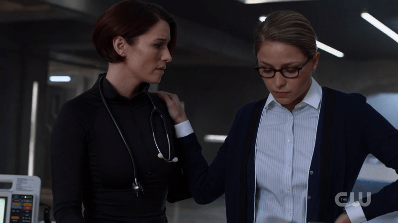 Kara rests a relieved hand on Alex's shoulder