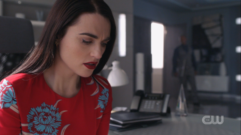 Lena looks worriedly at her phone