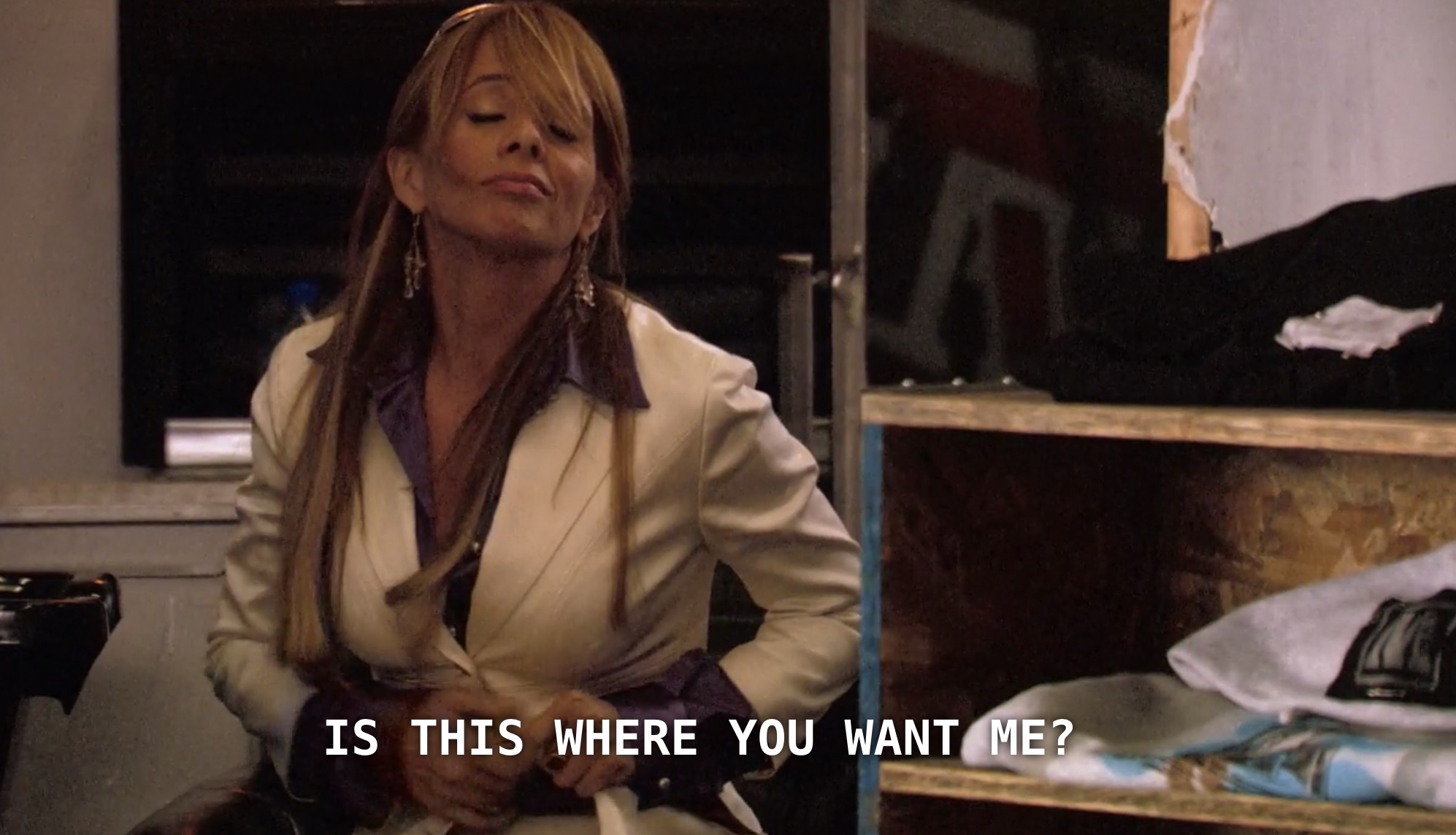 Cherie has arrived at the skate shop for Shane to cut her hair. She asks Shane, "is this where you want me?"