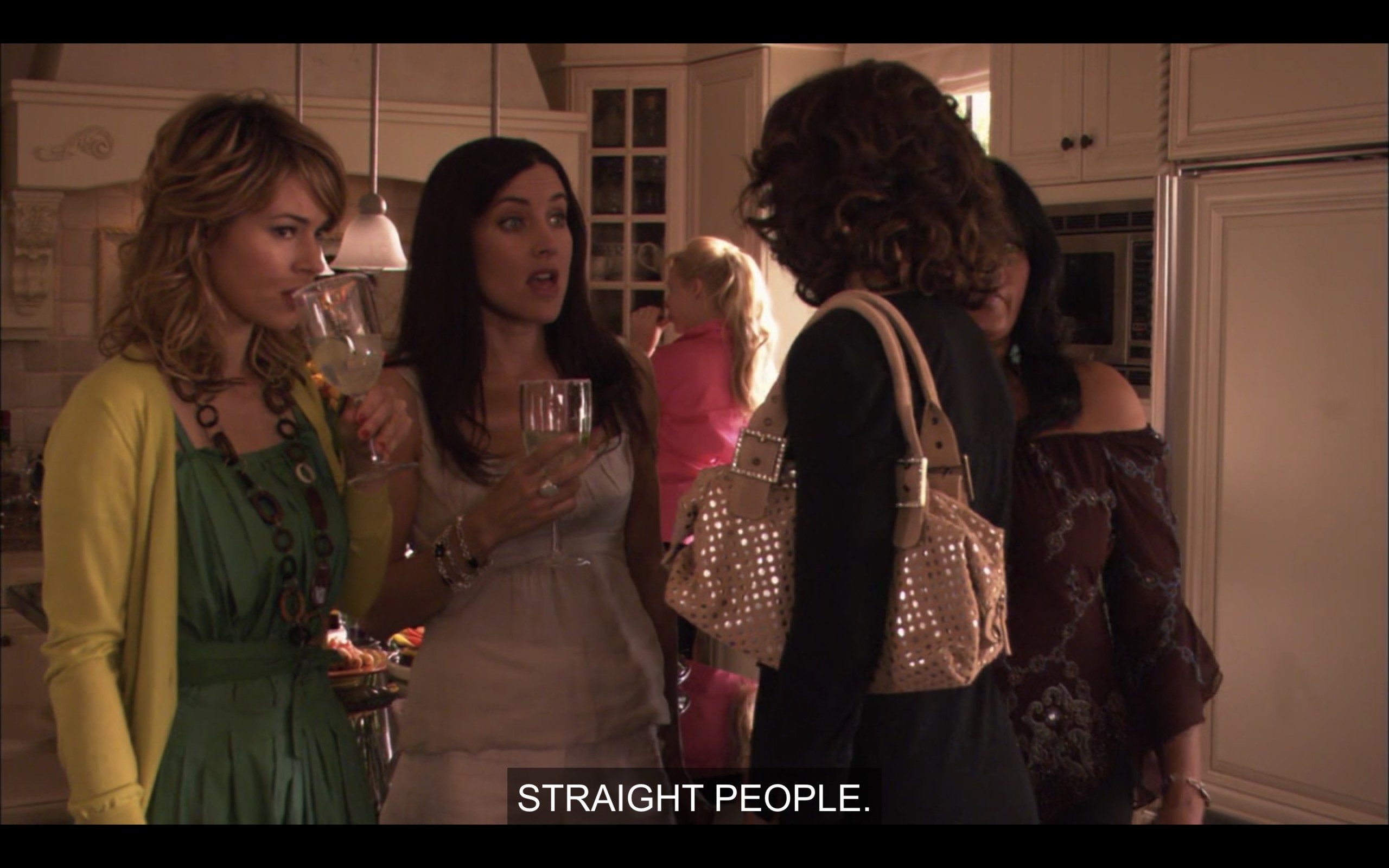 Alice, Helena, Kit, and Bette are at Tina and Henry's house party. Alice says that they're being outnumbered by straight people.