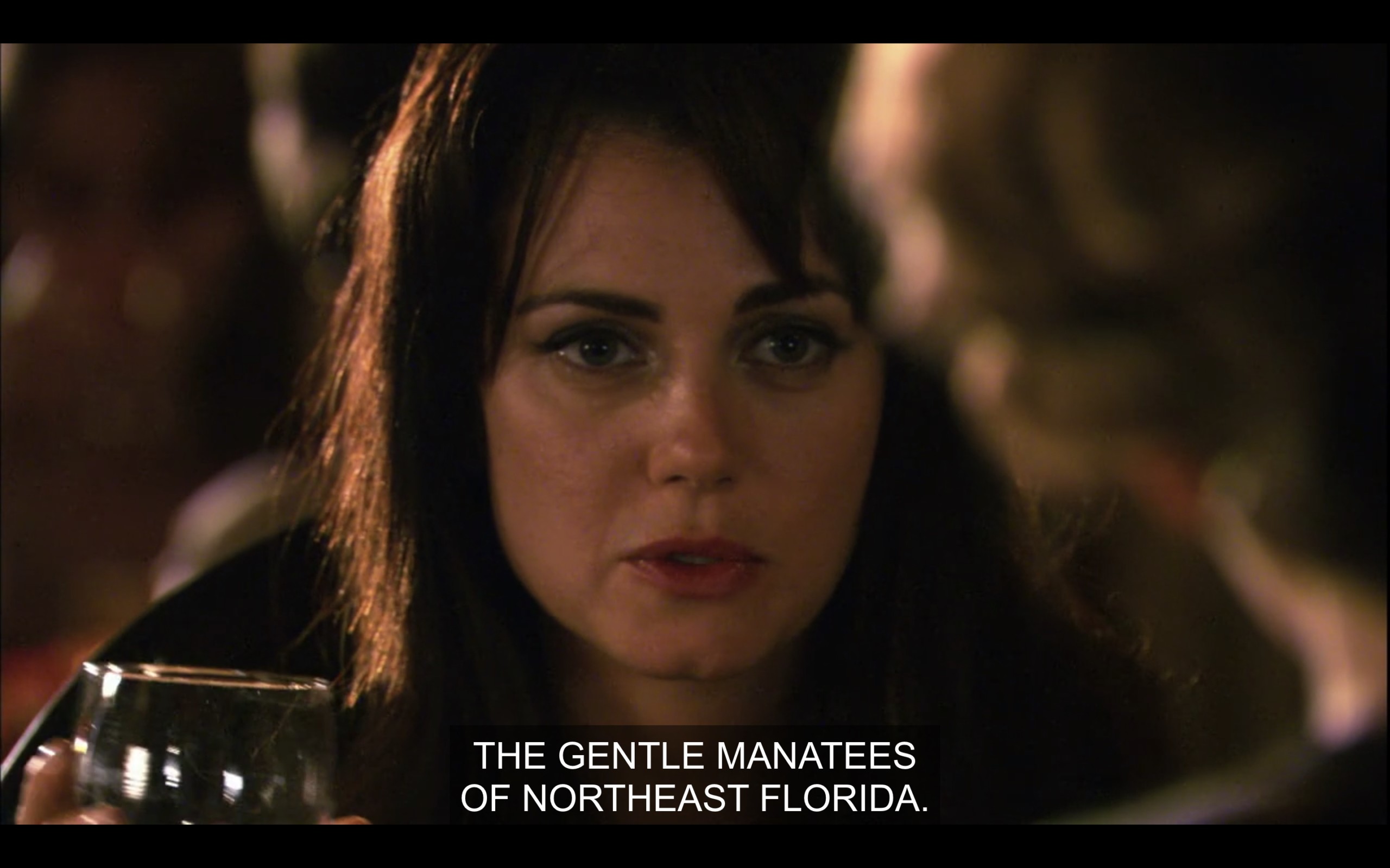 Close-up of Jenny, holding a wine glass. "The gentle manatees of northeast Florida."