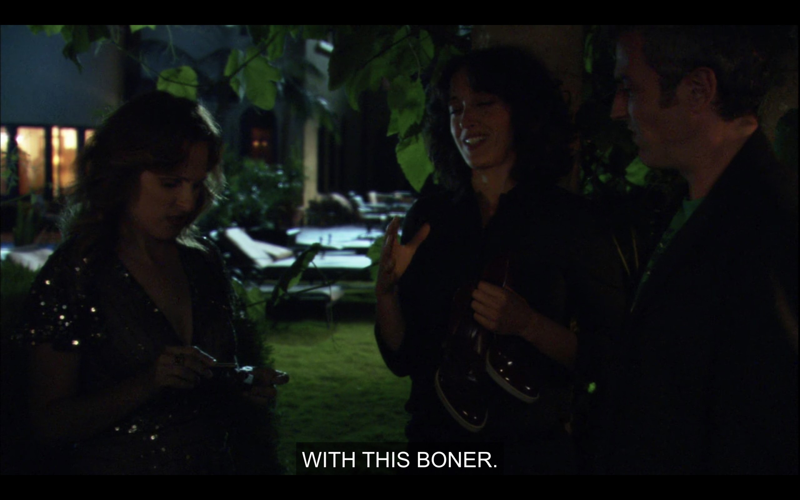 Jodi, Bette, and Tom stand outside in the dark in a semi-circle. "With this boner."