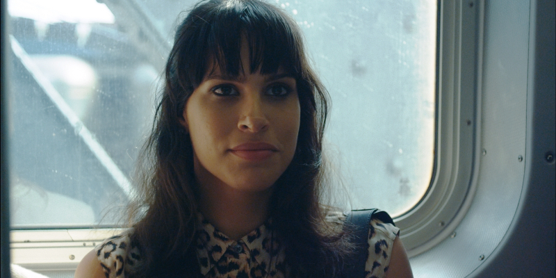 A still from Appropriate Behavior. Desiree Akhavan sits on a New York subway.