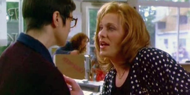 A trans woman in polka dots talks to a cis butch lesbian. 