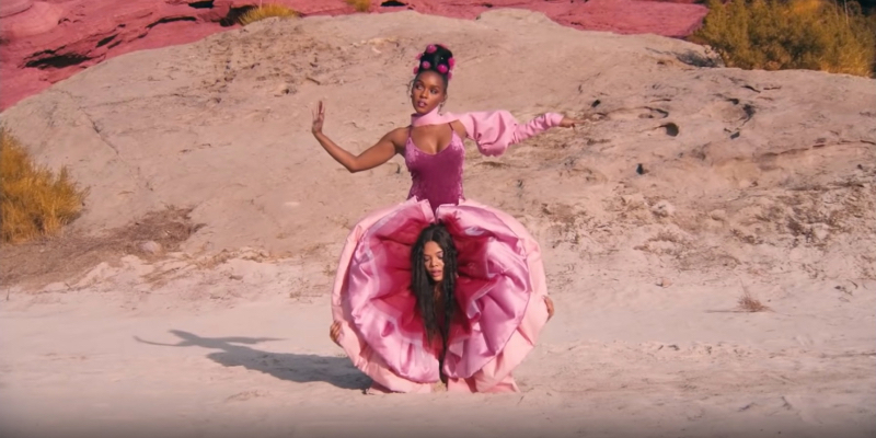 A still from the 20th best lesbian movie of all time Dirty Computer. Janelle Monรกe in pussy pants with Tessa Thompson's head between her legs.