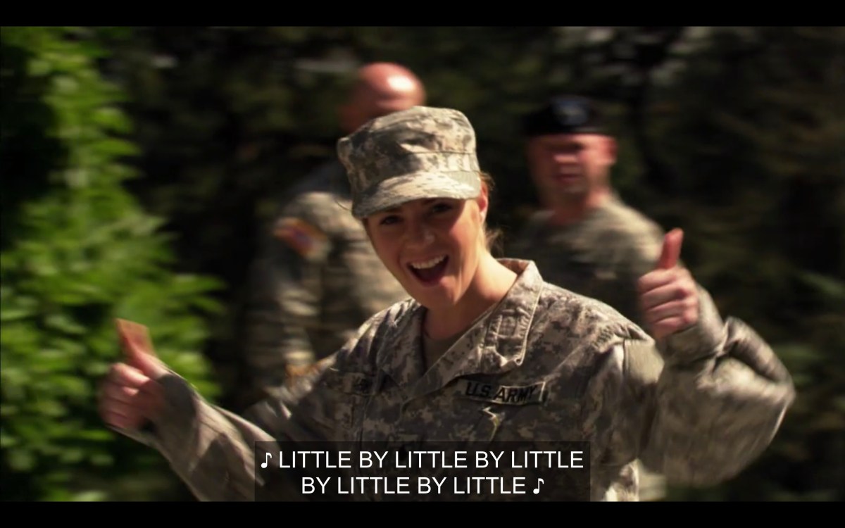 Soldier gives two thumbs up to Tasha and Alice
