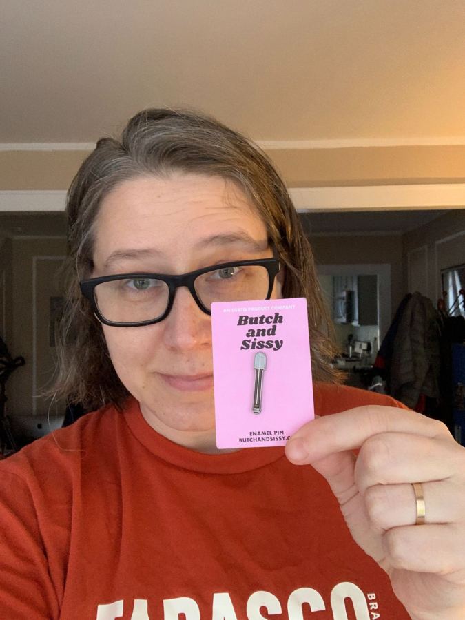 Heather holding the very pin this member suggested someone buy for her! it is a mini thermometer from the show, Gentleman Jack