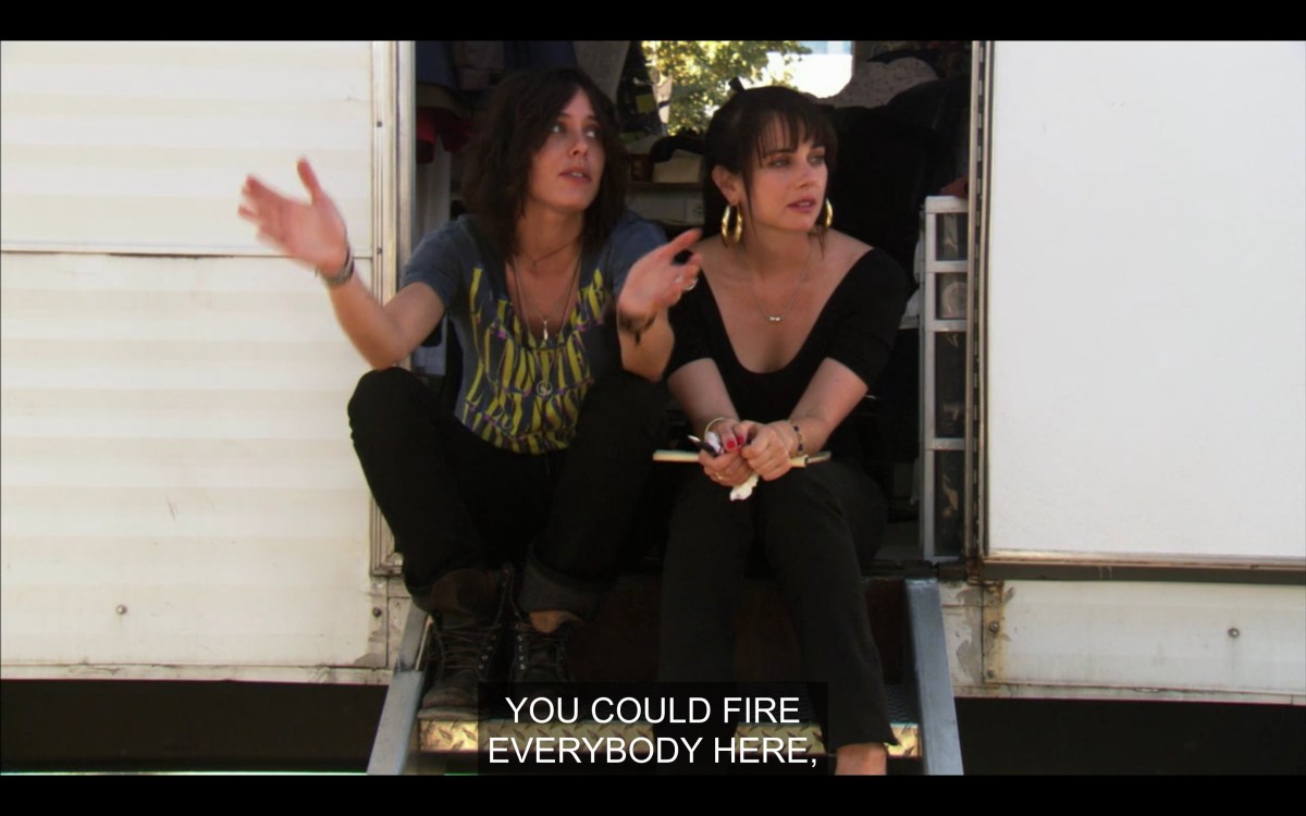 Shane and Jenny sitting outside the trailer at Lez Girls