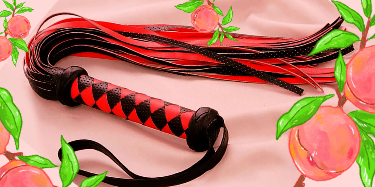 Scarlet Couture Diamond Whip - a red and black whip with a diamond pattern on the handle, and a leather loop strap for your wrist