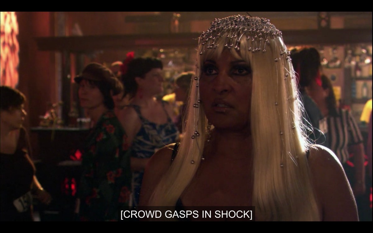 Kit in a Cleopatra get-up in the audience as "crowd gasps in shock"