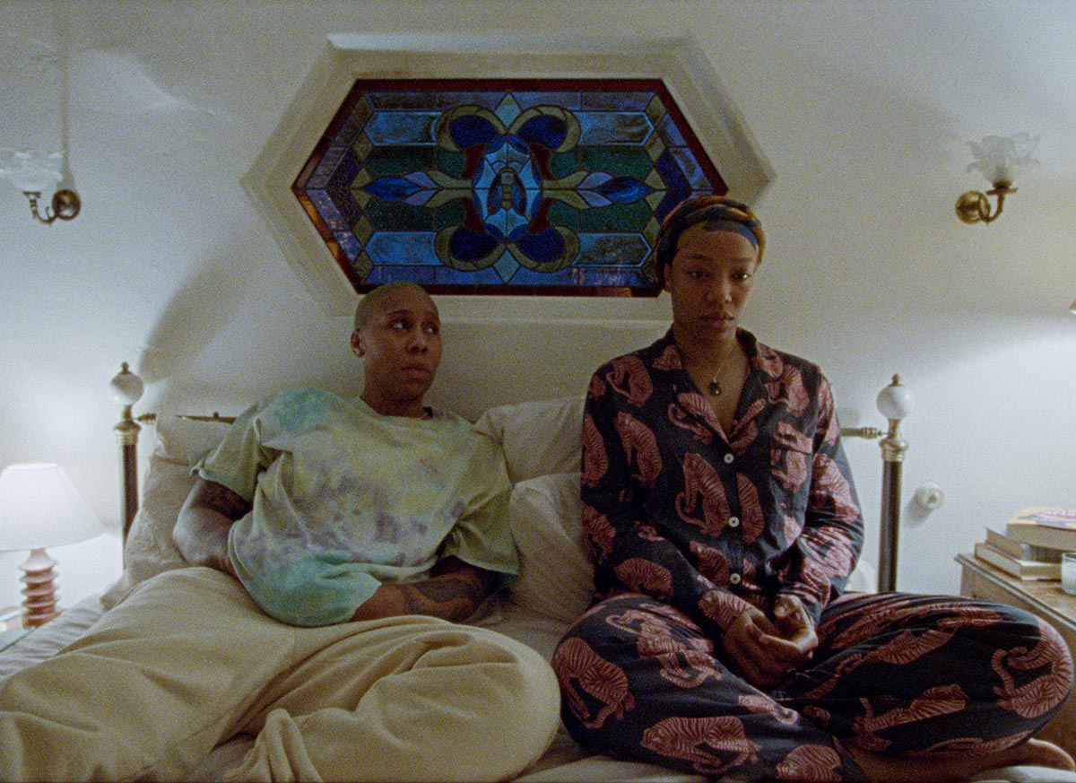 Lena Waithe in the third season of Master of None as Denise. She sits in bed with her wife at night.