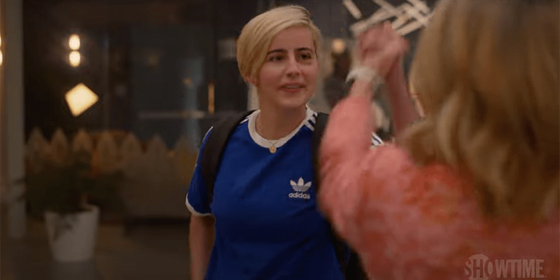The L Word Generation Q Season 2 Trailer: Finely with a black eye in a blue Adidas soccer shirt giving a high five