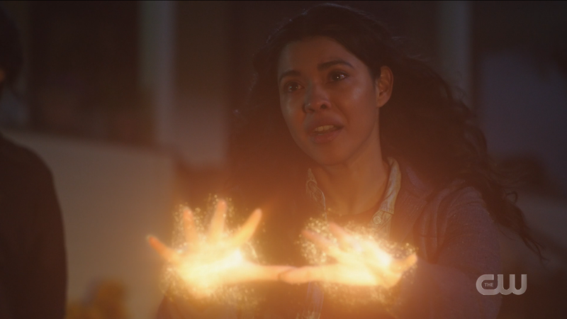 Spooner's hands glow as she takes down the bad men
