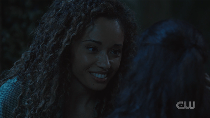 Astra smiles softly and lovingly at little Esperanza