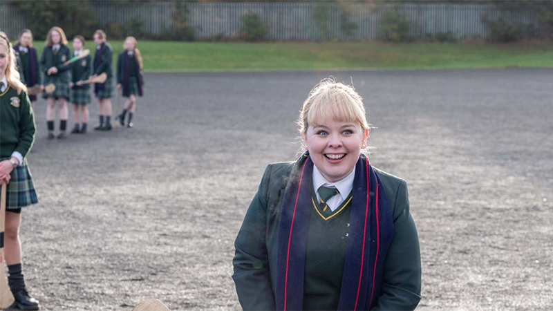 Clare smiles at her friends