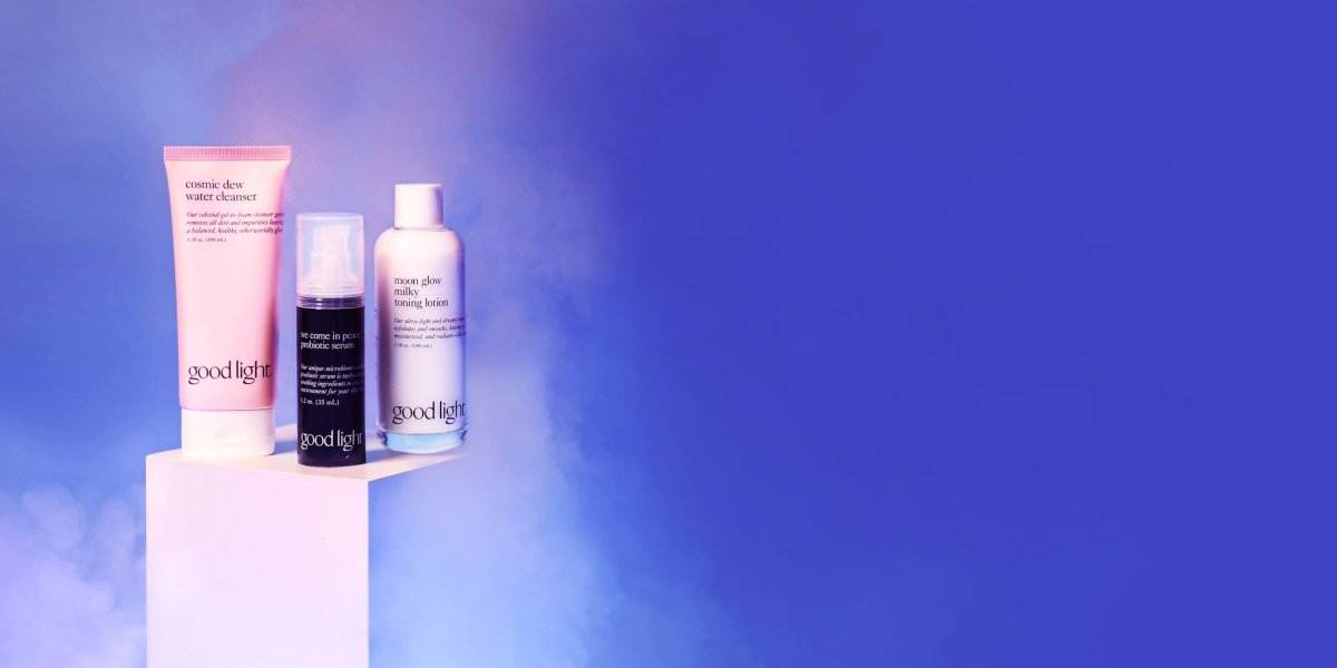 Cosmic Drew water cleasner, We come in peace probiotic serum, moon glow milky toning lotion in front of a purple screen