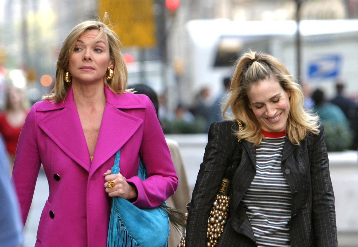 Kim Cattrall and Sarah Jessica Parker during Kim Cattrall and Sarah Jessica Parker On Location For "Sex And The City" at Saks Fifth Ave in New York, New York, United States. (Photo by James Devaney/WireImage)