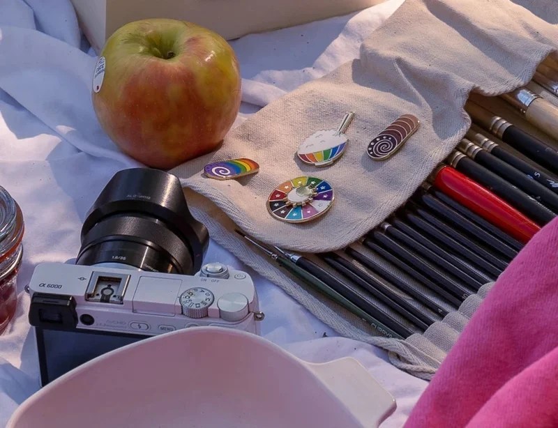 pins and pencils on a blanket