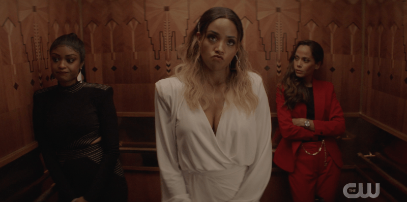 Ryan, Sophie, and Renee awkwardly stand in an elevator