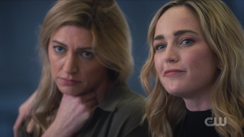 Ava and Sara look sadly but fondly at Gideon