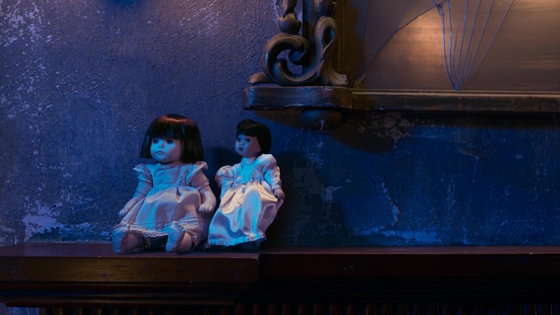 Callie and Mariana's dolls sit on the shelf