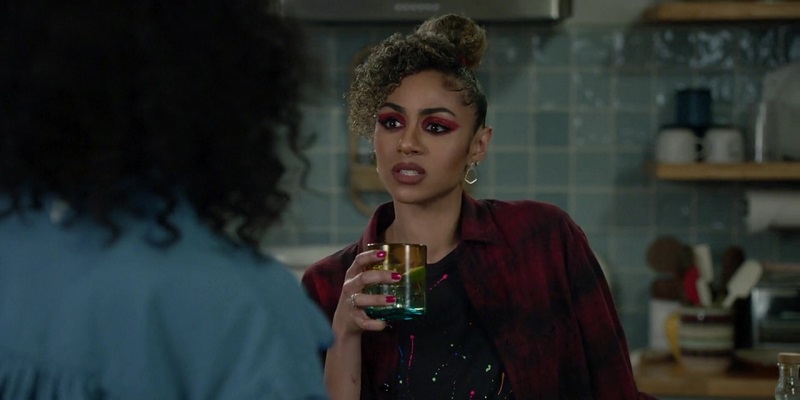 Patience holds her drink glass to toast her latest epiphany: the name of her debut album!