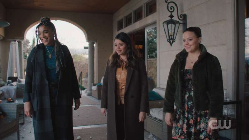 The Charmed Ones (2022) stand together, smiling and triumphant