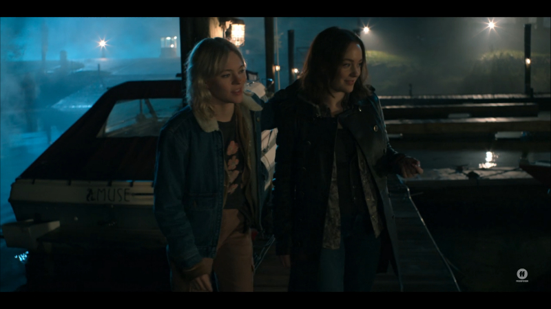 Raelle and Scylla on a dock looking for boats