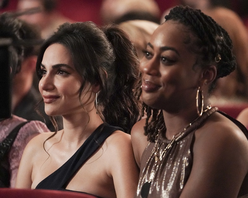 Angelica and Malika watch as Jazmin and Spencer exchange their vows. 