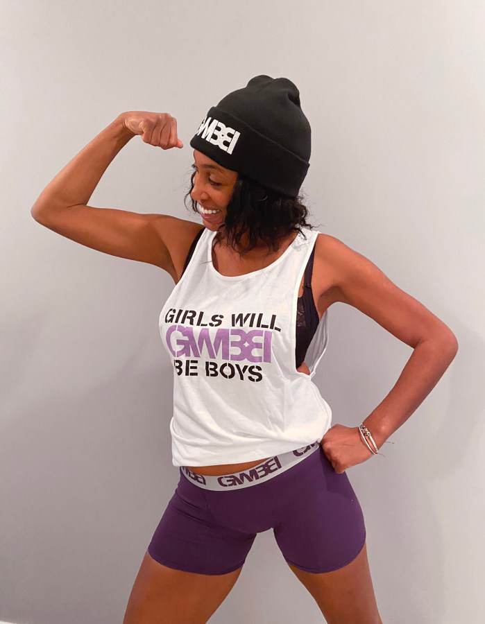 a model shows a GWBB tank top, boxer briefs and beanie