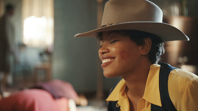 Max wakes up in a cowboy hat with a kiss on her cheek. 