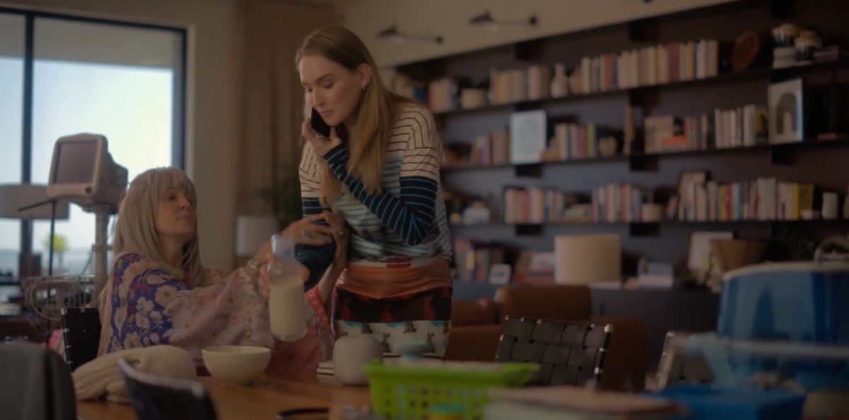 Tess and her Mom barter over a carafe of milk in Tess's apartment