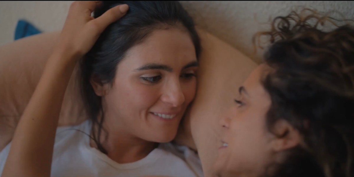 dani in bed looking cutely at gigi