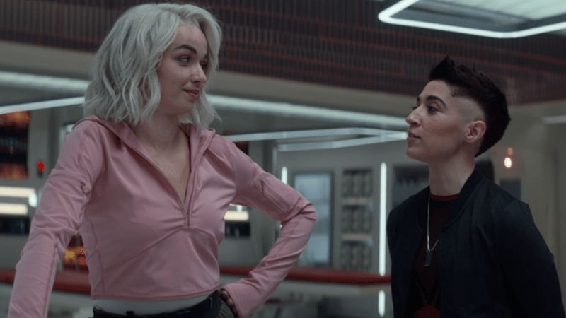 Screenshot from Star Trek Strange New Worlds of bisexual Nurse Chapel with her hand on her hip recounting a story