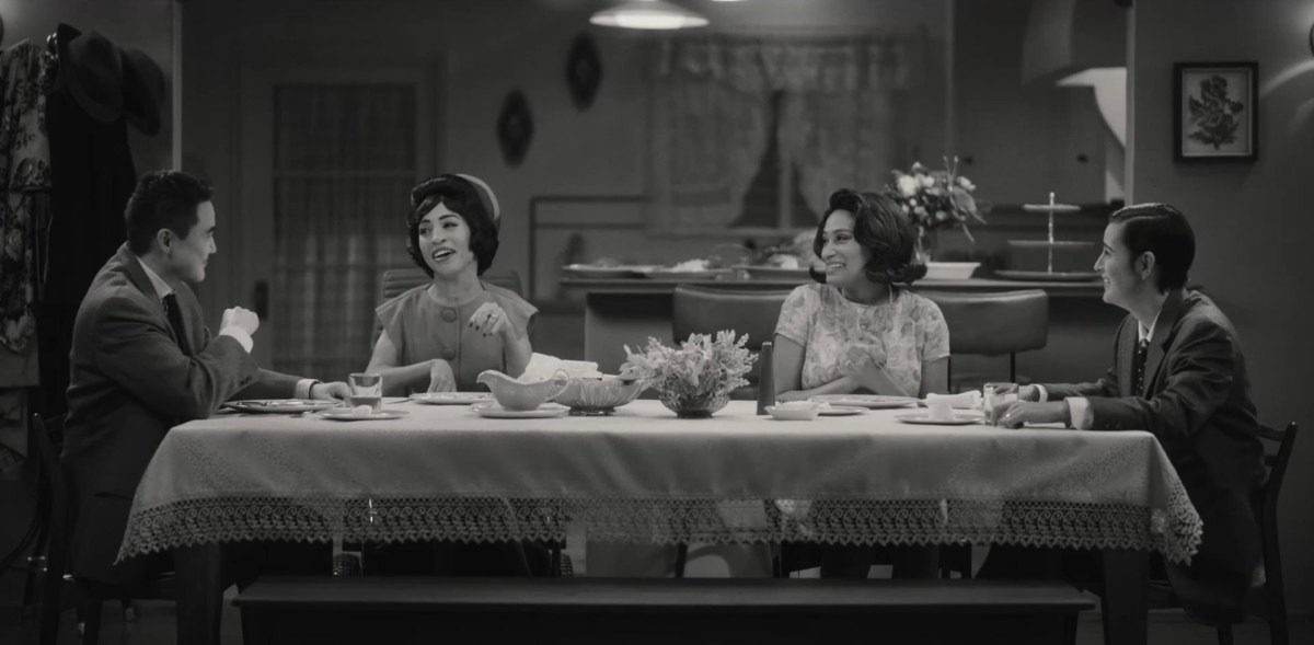 Micah, Maribel, Sophie and Finley at their dining room table laughing