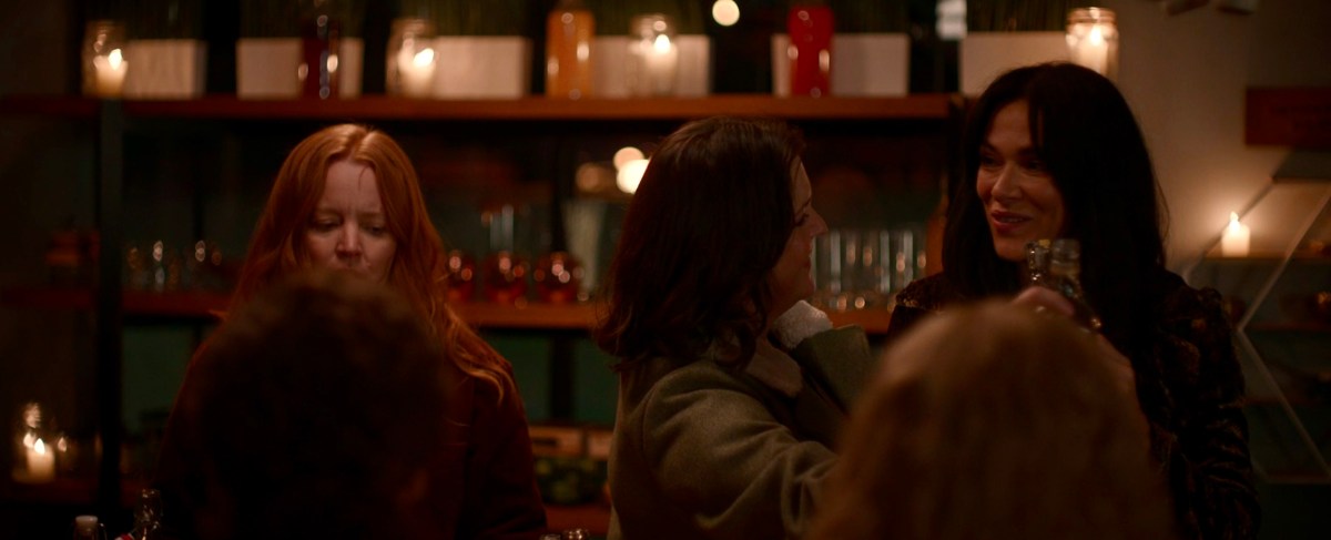 Shauna and Lottie cheersing each other as adults in Yellojackets 207