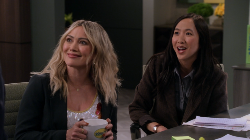 Sophie and Ellen smile up at their boss. 