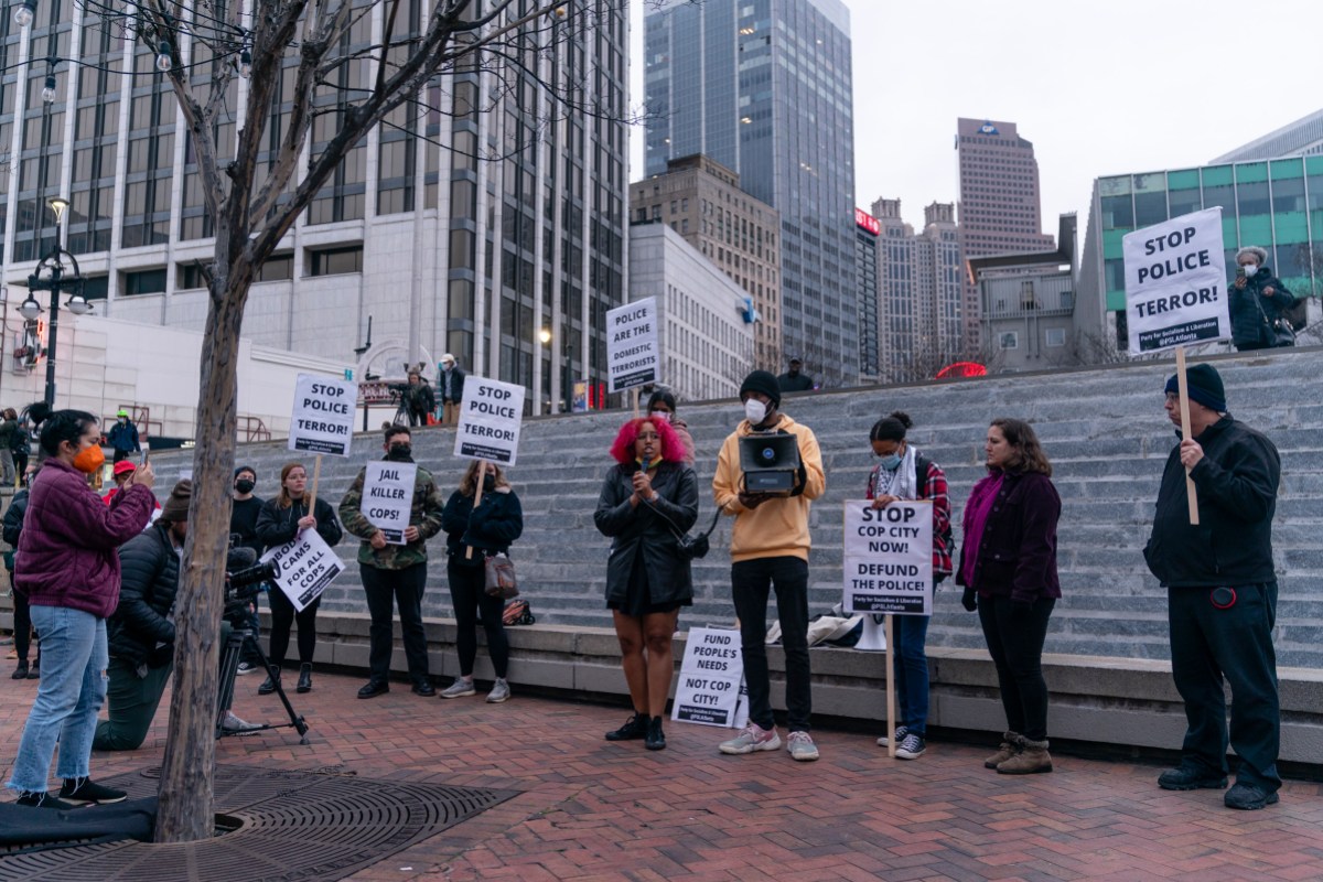 ATLANTA, GA - JANUARY 21- A woman speaks during a protest following the shooting death of Manuel Teran during a police raid on their encampment inside Weelaunee People's Park, the site of the proposed 'Cop City' training facility, earlier in the week, on Saturday, January 21, 2022 in Atlanta, GA.