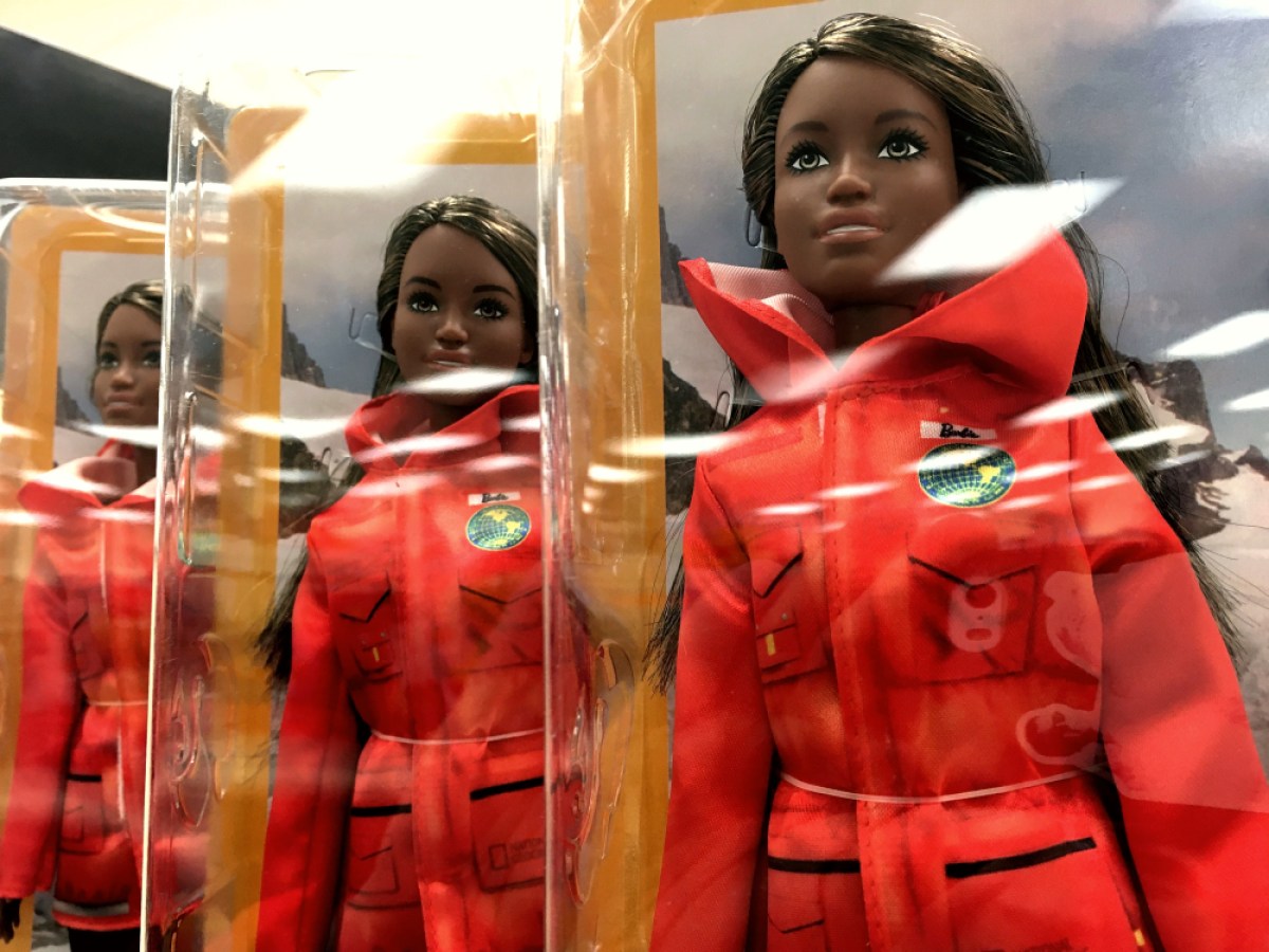 a line up of a series of Black marine biologist barbies