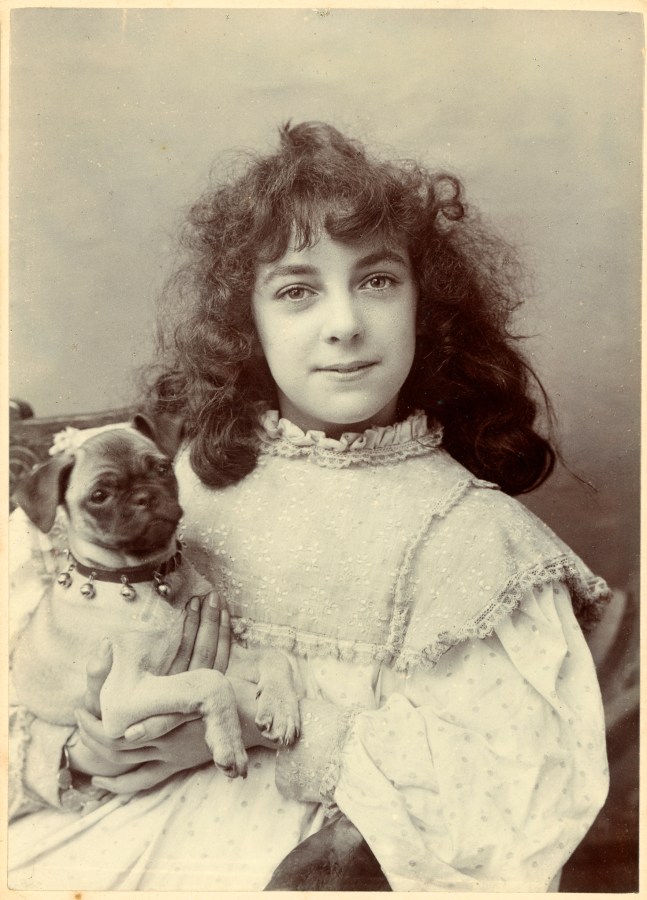 a cute photo of a victorian girl with her dog