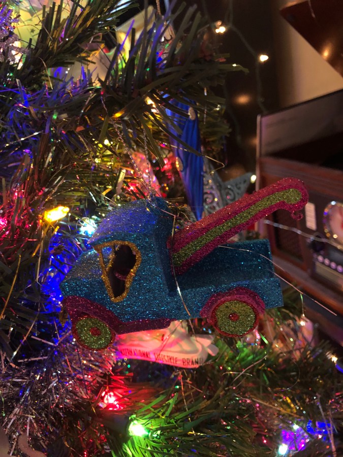a glitter tow truck ornament