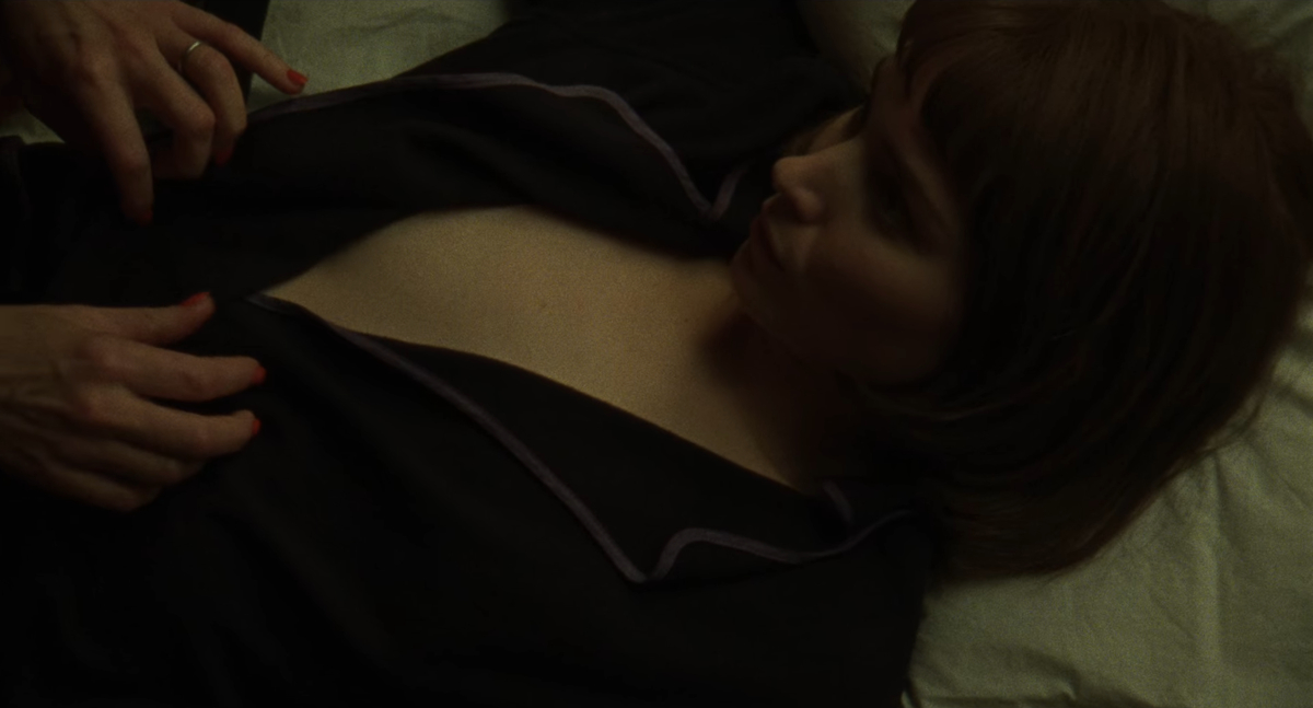 Carol sex scene: Carol's hands open Therese's robe